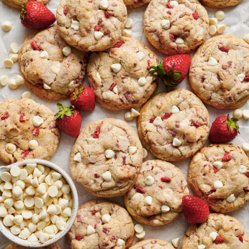 Strawberries and Cream Cookies bake up golden brown and are loaded with freeze dried strawberries (they pack in a ton of strawberry flavor) and white chocolate chips! Pretty, pink, and sure to please, these cookies will quickly become a family favorite. No cookie dough chilling required!