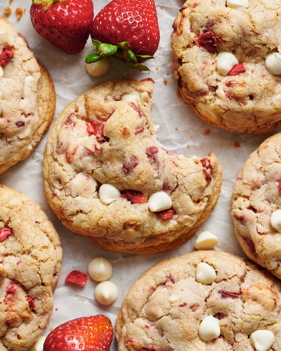 Strawberries and Cream Cookies bake up golden brown and are loaded with freeze dried strawberries (they pack in a ton of strawberry flavor) and white chocolate chips! Pretty, pink, and sure to please, these cookies will quickly become a family favorite. No cookie dough chilling required!