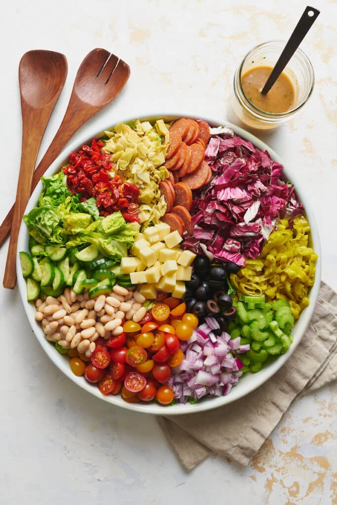 Big bowl of chopped salad ingredients ready to be tossed together. 