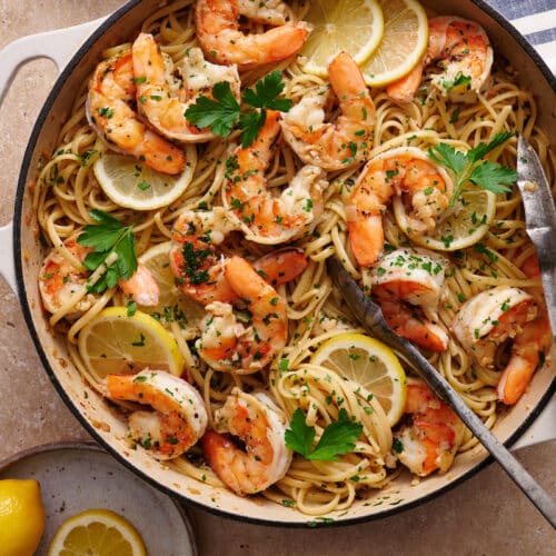 Learn how to cook shrimp scampi in 20 minutes with this easy shrimp scampi recipe! Juicy shrimp are cooked in garlic butter, white wine, and lemon juice creating the most delicious shrimp scampi sauce ever! Sprinkled with fresh parsley and red pepper flakes. We love serving this with pasta (we love linguini or angel hair), zucchini noodles, crusty bread, and dry white wine.