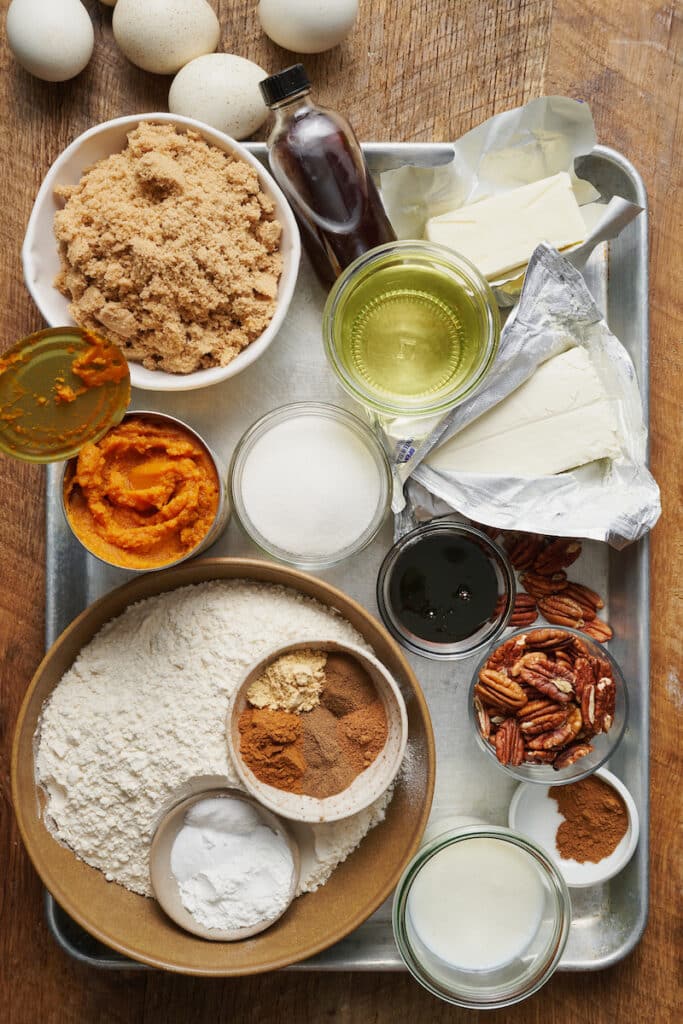 Ingredients for pumpkin bundt cake on baking tray.