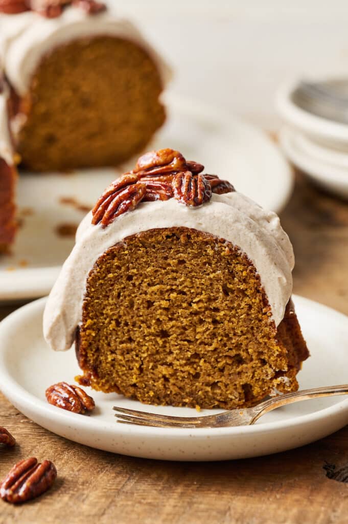 Slice of pumpkin bundt cake on a dessert plate.