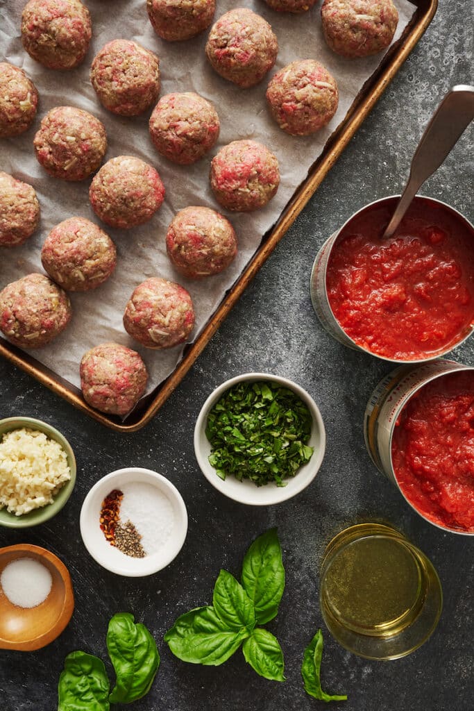 Baking meatballs on a baking sheet.