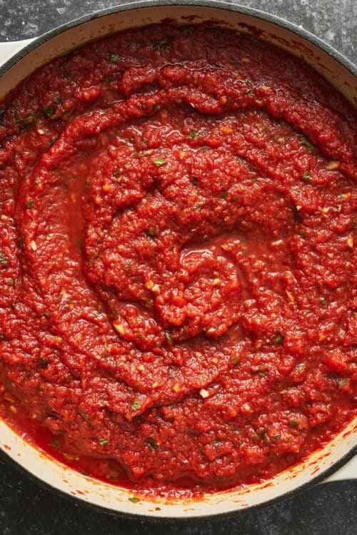 Marinara sauce in a large pan.