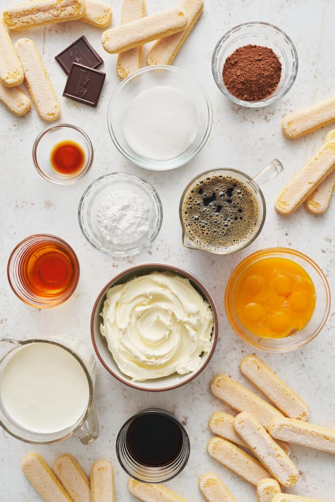 Ingredients for tiramisu recipe on a white plate.