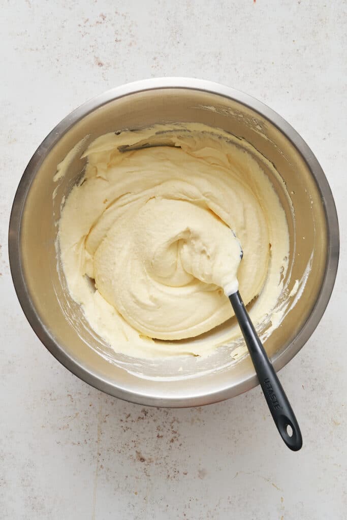 Whipped cream and egg yolks for mascarpone mixture.