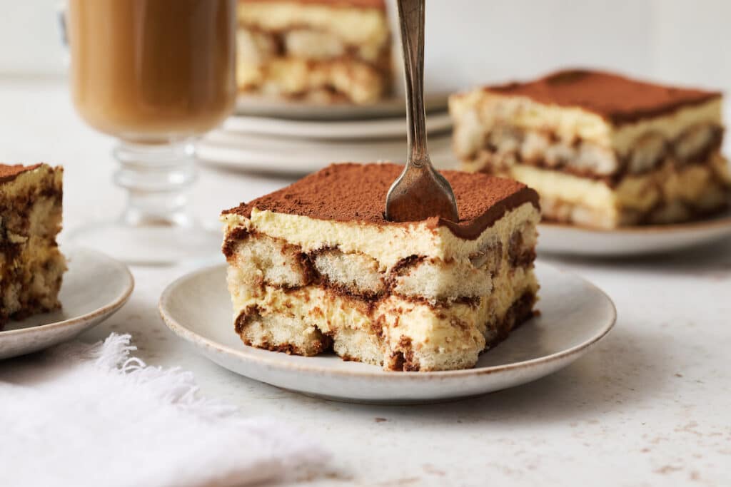 Slice of tiramisu on plate.