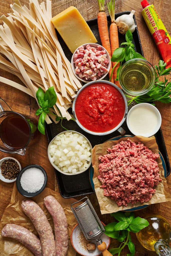 Ingredients for bolognese sauce on a large tray.