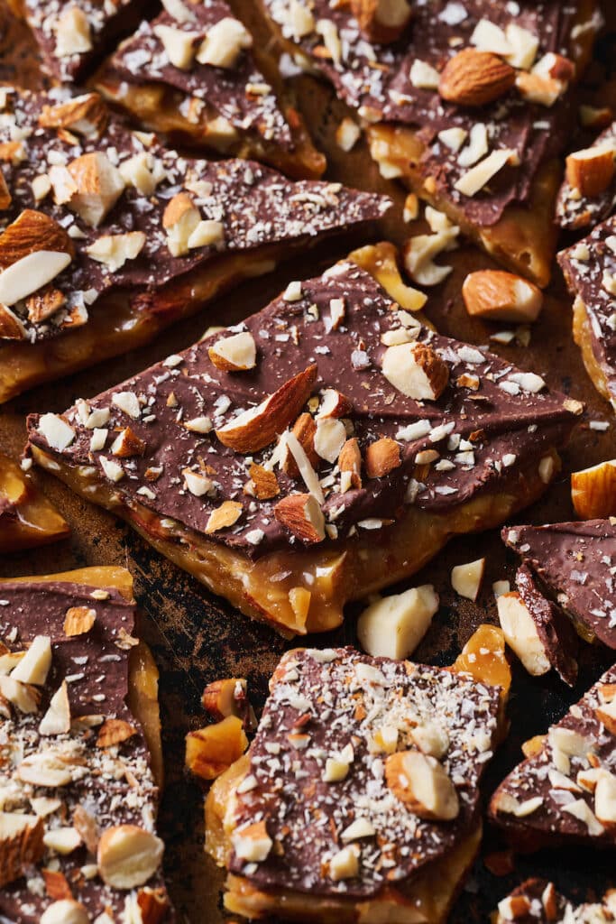 Chopped up homemade toffee covered with chocolate and almonds. 