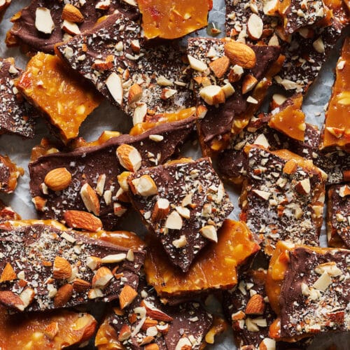 Tray of chopped up toffee on baking sheet.