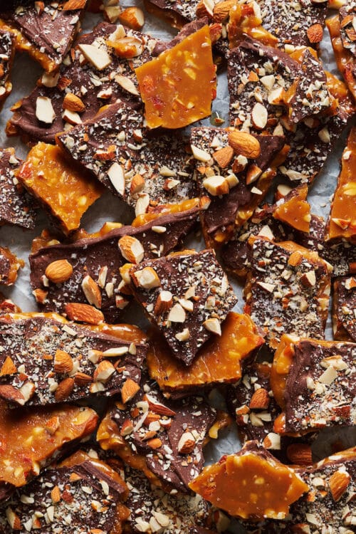 Tray of chopped up toffee on baking sheet.