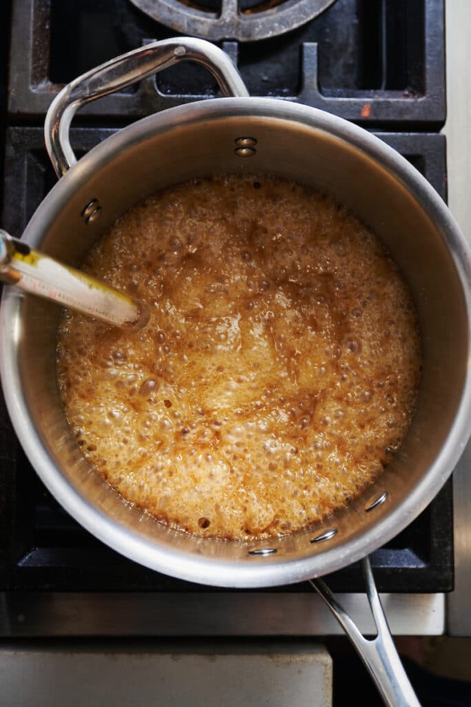 Butter toffee being cooked on the stovetop.