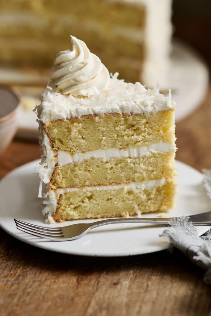 Coconut Cake on a white plate.