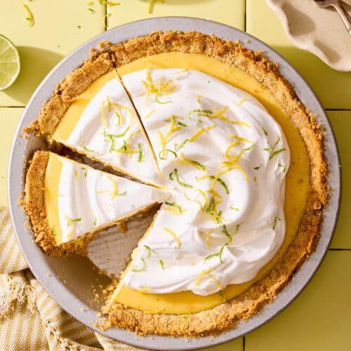 Atlantic beach pie topped with whipped cream and citrus zest in a pie plate.