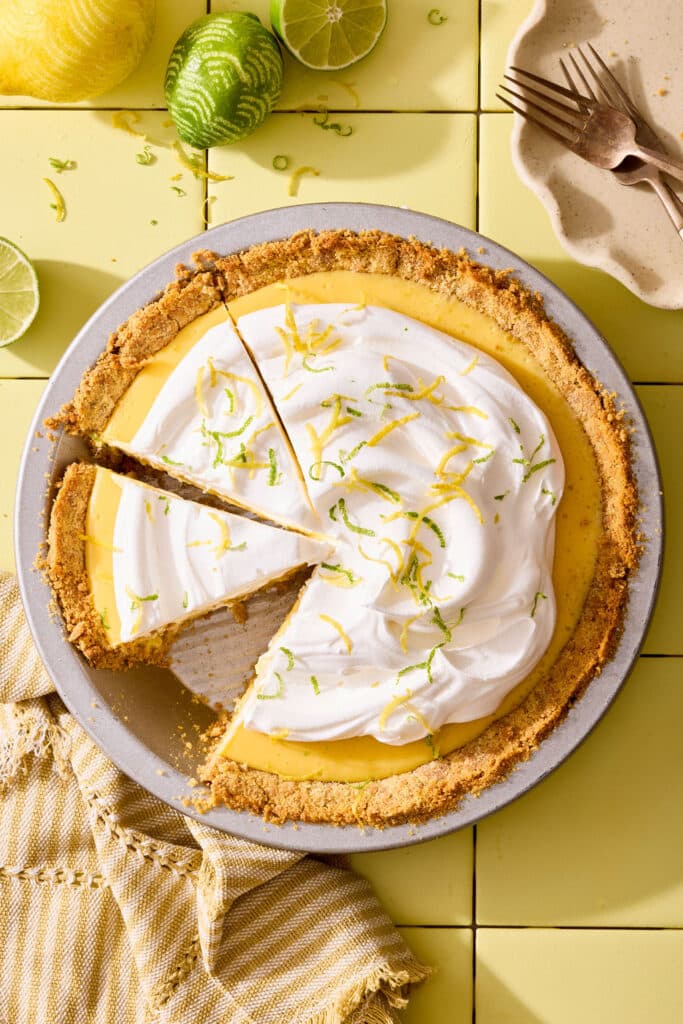 Atlantic beach pie topped with whipped cream and citrus zest in a pie plate.